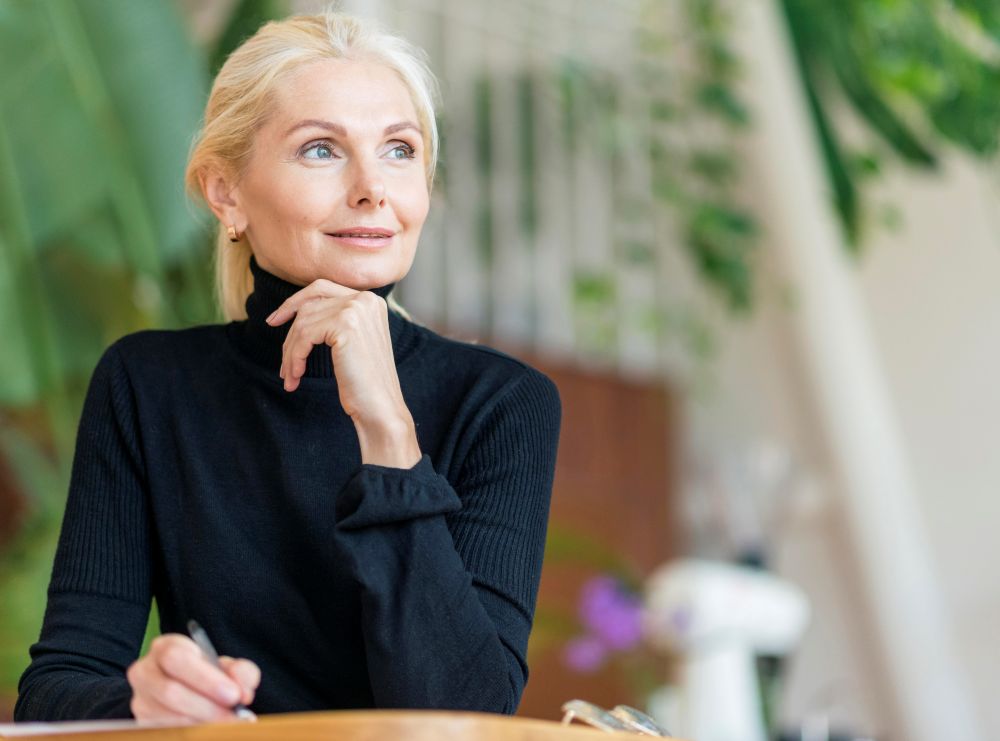 front-view-older-woman-working-with-pen