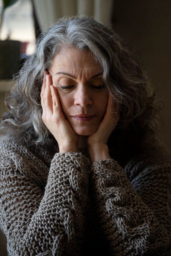sad-elder-woman-sofa